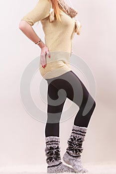 Woman legs in black pantyhose woolen warm socks