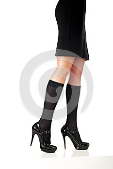 woman legs with black skirt and fashion shoes