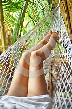 woman legs in hammock.Vacation concept