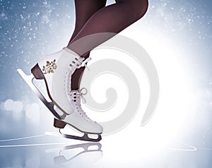 Woman legs in ice skating boots photo