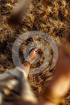 Woman legs in native indian american boho dress walking in windy