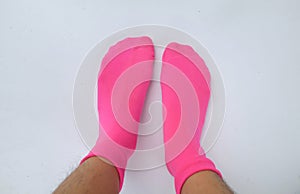 Woman legs in new pink socks isolate  on white background