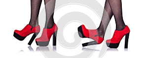 The woman legs with red shoes isolated on the white