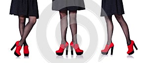 The woman legs with red shoes isolated on the white