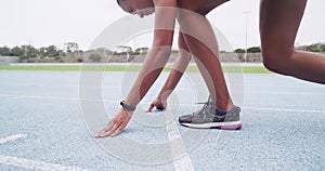 Woman, legs and starting line for running, race and speed for sports, cardio and event on stadium track. Closeup of