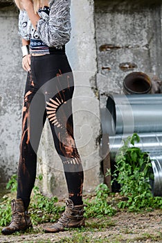 Woman legs in stylish and trendy leggings