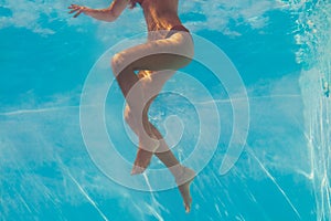 Woman legs under water