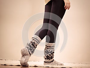 Woman legs in woolen warm socks