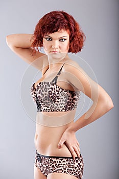 Woman in leopard spotted set of clothes pose