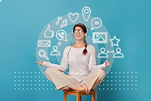 Woman levitates in lotus position with headset.