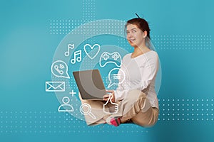 Woman levitates in lotus position with laptop.