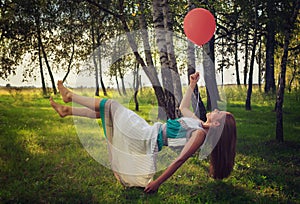 Woman levitating in the forest photo