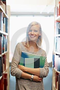 Woman, library and books, portrait for education and knowledge with smile on campus. College student, bookstore and