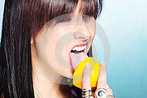 Woman lick lemon