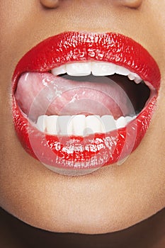 Woman Licking Red Lips