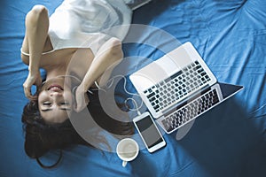 Woman Lie down and listen to music