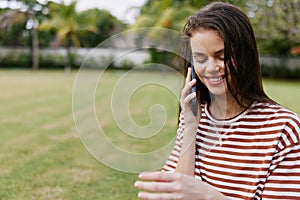 woman lifestyle phone app smiling grass nature park tree blogger palm happy