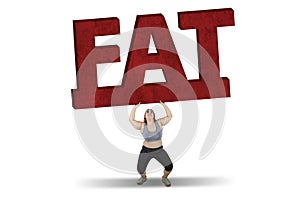 Woman lifting fat word