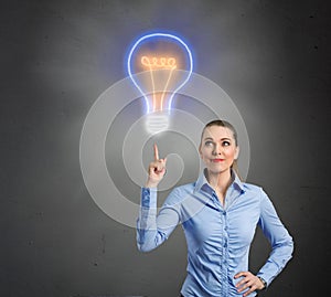 Woman with lightbulb as concept of solution and idea