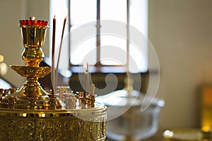 Woman lighting candles in a church