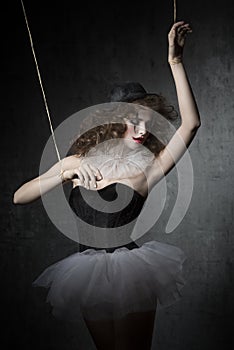 Woman like gothic marionette dancer