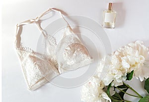 Woman lingerie with accessories and flowers collage on white, flat lay, top view.