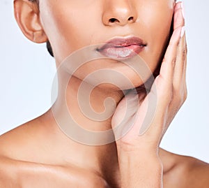 Woman, lips and beauty closeup with makeup, face and lipstick glow in studio. Mouth, skincare and hands of a female