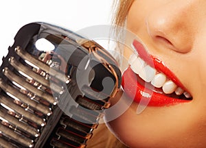 Woman lips with retro microphone