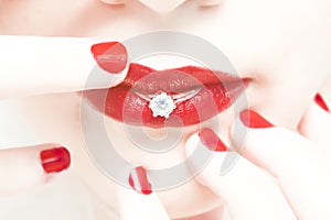 Woman lips wedding ring