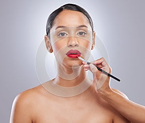 Woman, lipstick and studio with product, hand and cosmetic makeup for beauty. Cosmetology, portrait or skincare for