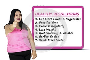 Woman with a list of healthy resolutions