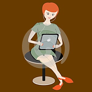 Woman listen music from tablet and reads. Girl with red hair holds tablet computer with plug phones
