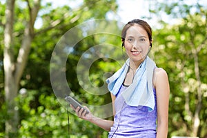 Woman listen to music with cellphone