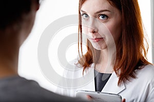 Woman listening attentively to a friend or work colleague