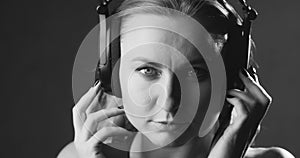 Woman listening music in headphones