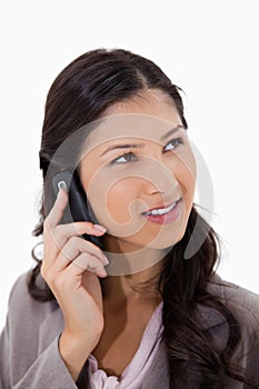 Woman listening to caller on the phone