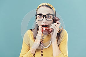Woman listening to interesting gossips on the phone