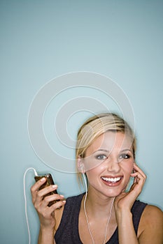 Woman listening to MP3 player