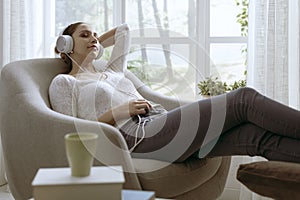 Woman listening to music with eyes closed