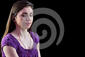 Woman listening to music with eyes closed