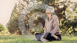 Woman listening to music with headphones in the nature