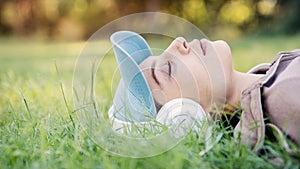 Woman listening to music with headphones in the nature