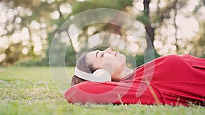 Woman listening to music with headphones in the nature