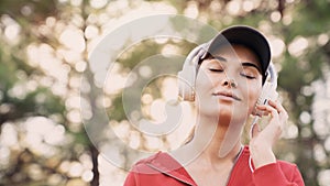 Woman listening to music with headphones in the nature