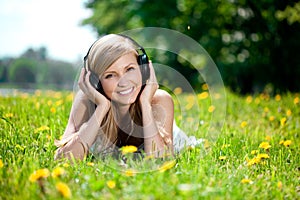 Woman listening to music on headphones o