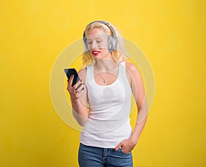 Woman listening to music on headset from her phone