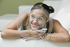 Woman Listening To Music On MP3 Player