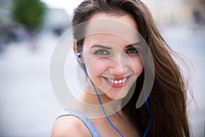 Woman listening to music outdoors