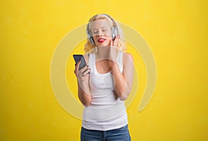 Woman listening to music on wireless headphones