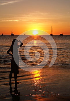 Woman lit by the setting sun